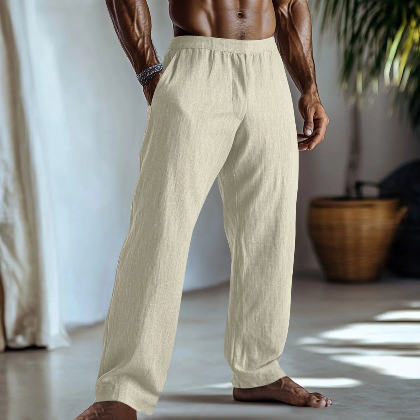 Straight-leg cotton linen trousers in light green colour with visible pockets and British style design.