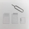 SIM Restore four-in-one adapter set with three SIM cards and metal picking pin in black and white