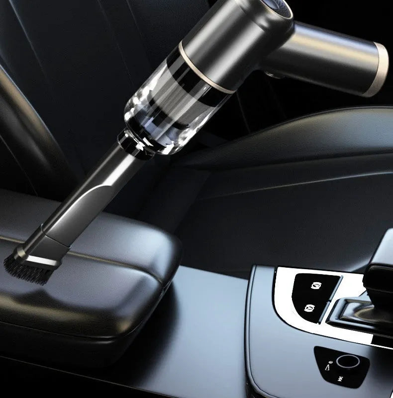 Black wireless car vacuum cleaner with multiple nozzle attachments including brush heads and suction tubes