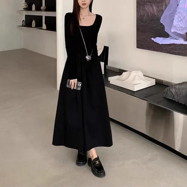 Women's black square collar knitted dress with long sleeves and an elastic A-line waist.