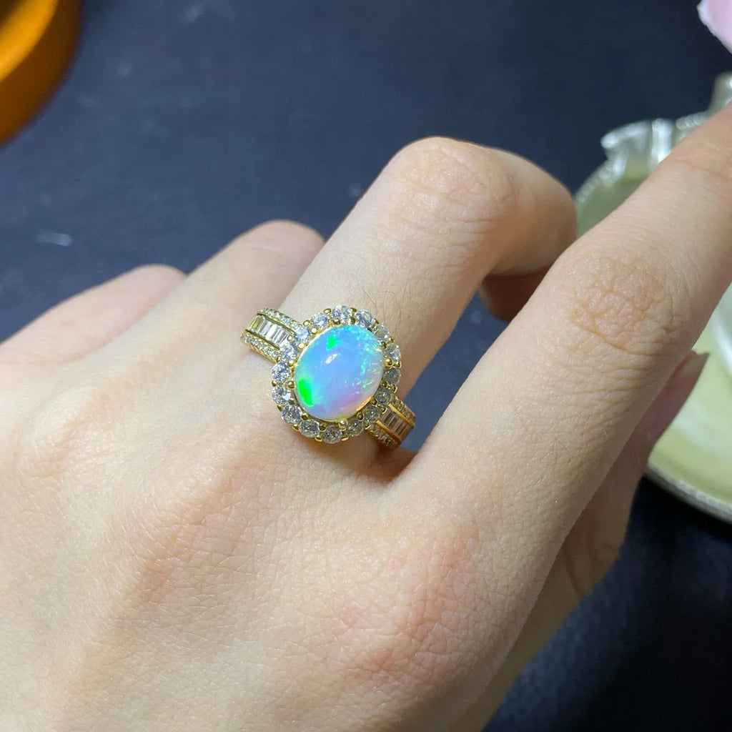 Handmade natural opal silver ring in gold colour with adjustable opening on hand