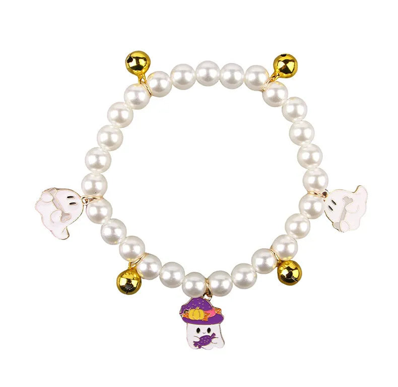 Halloween decorative cat collar with simulated pearl necklace in purple ghost pumpkin, skull pumpkin, and smiling pumpkin patterns.