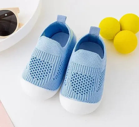 Baby soft sole non-slip walking shoes in cream yellow with fly woven cotton upper and natural rubber sole