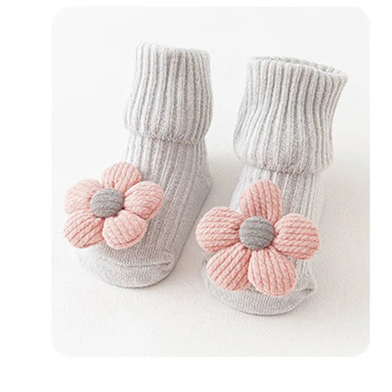 Cotton baby floor socks in multiple patterns including blue bow and lion designs