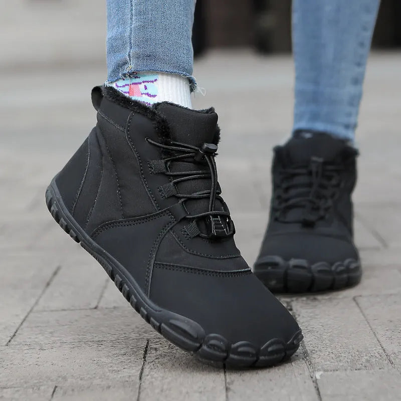 Outdoor snow boots with lace-up front, round toe, and black rubber sole shown in khaki colour.