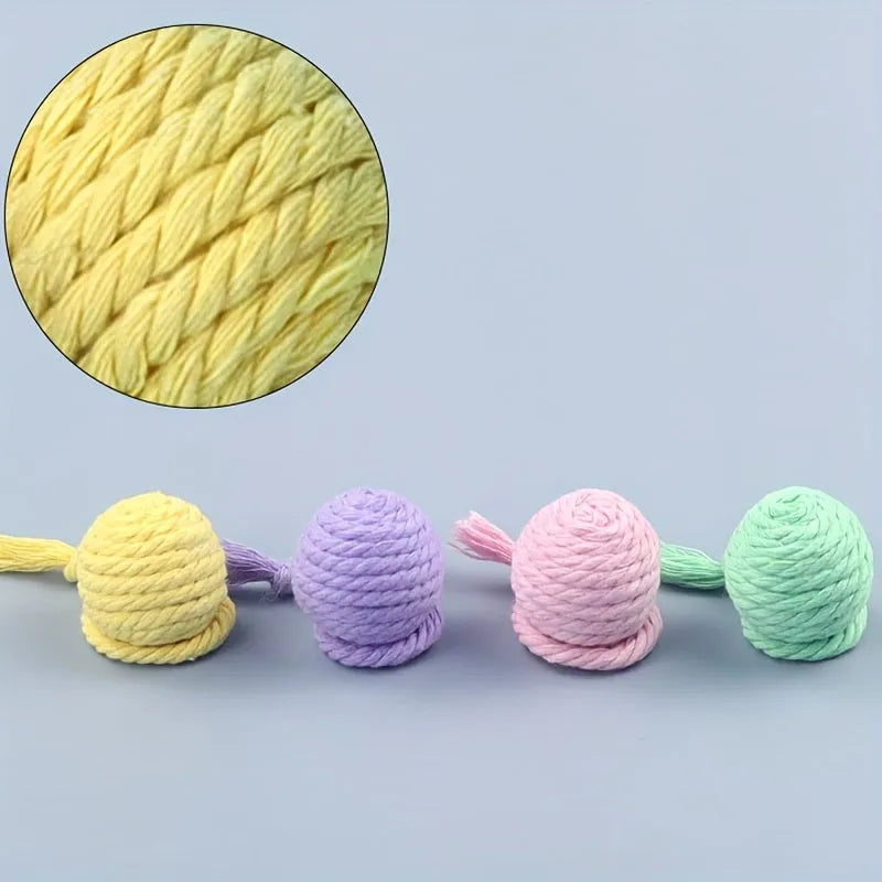 Cat toy ball with rope handle and bell inside in bright colours for kitten play
