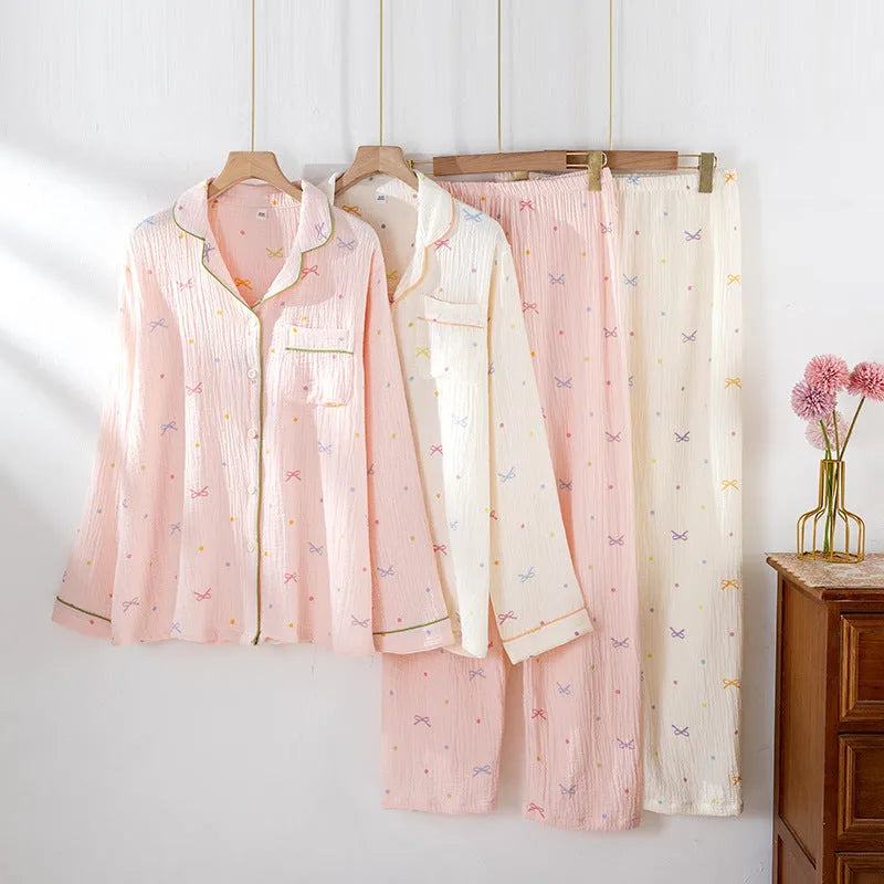Women's long sleeve cotton pyjama set in pink, featuring a simple casual style top and trousers.