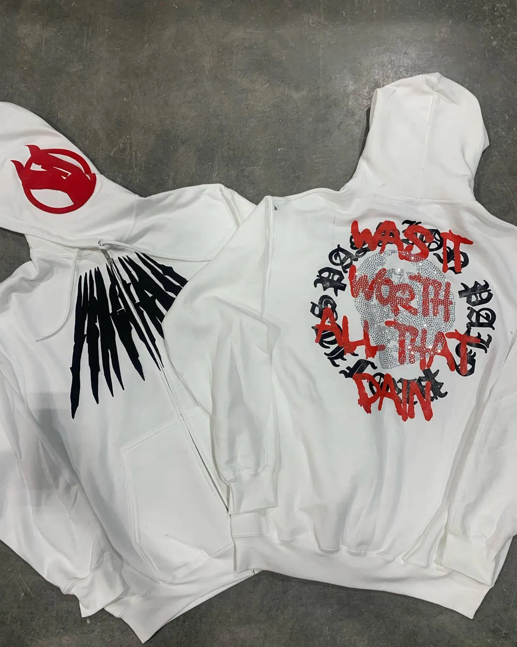 Black loose hooded sweatshirt with skull print and rhinestone design on model