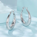 Geometric copper ear clip earrings with silver needle accents in classic ring design