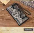 Brown genuine leather tri-fold wallet with embossed floral pattern showing interior compartments