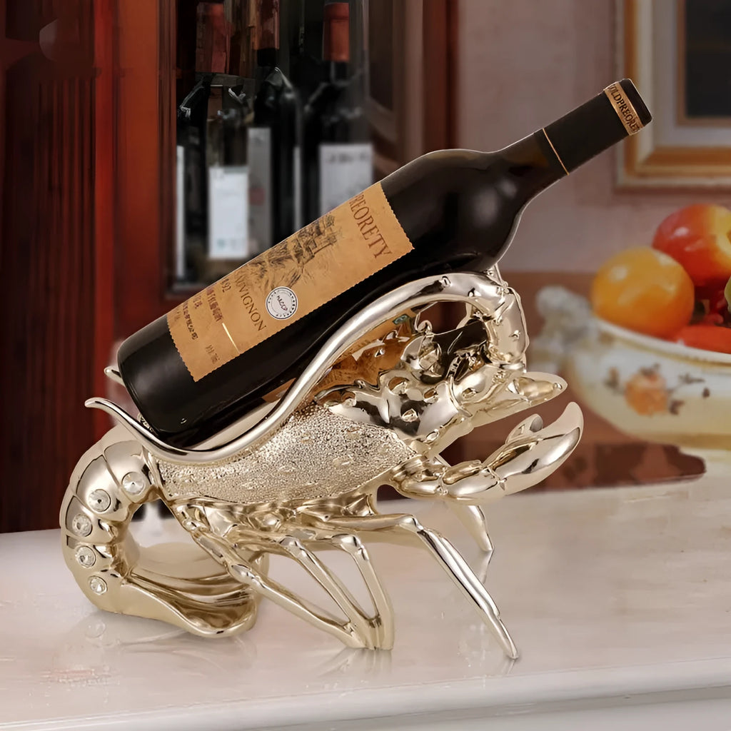 Lobster-shaped wine rack ornament in rose gold metallic finish displaying wine bottle