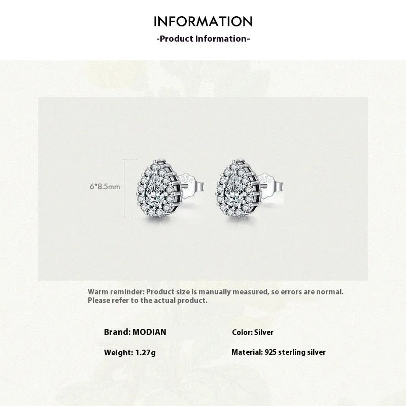 Silver waterdrop shaped ear studs with diamond-cut finish on 925 sterling silver