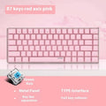 Pink and white 82 key mechanical keyboard with white backlight on a desk