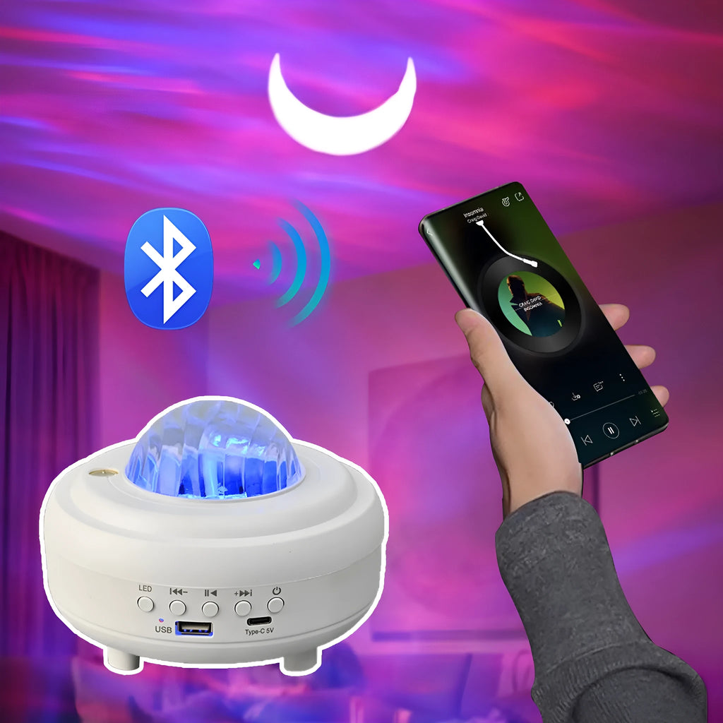 Galaxy star projector night light with 7 light effects and Bluetooth speaker in white rechargeable finish on a bedside table