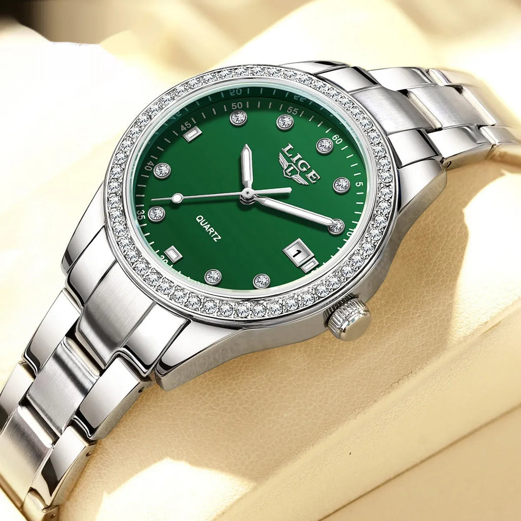 Silver stainless steel fashion quartz watch with diamond accents on dial, showing luminous markers.