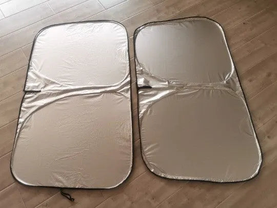 Aluminium foil car windscreen sunshade in silver, showing reflective surface.