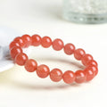Natural cherry red agate scattered bead bracelet with polished stones.