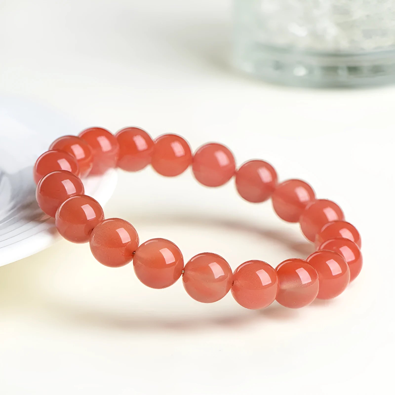 Natural cherry red agate scattered bead bracelet with polished stones.