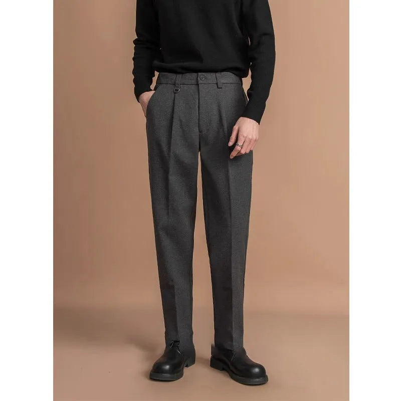 Men's straight leg suit trousers in draped fit, shown in dark grey colour.