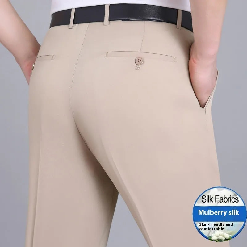 Men's straight-leg mulberry silk blend suit pants in dark blue on a hanger.