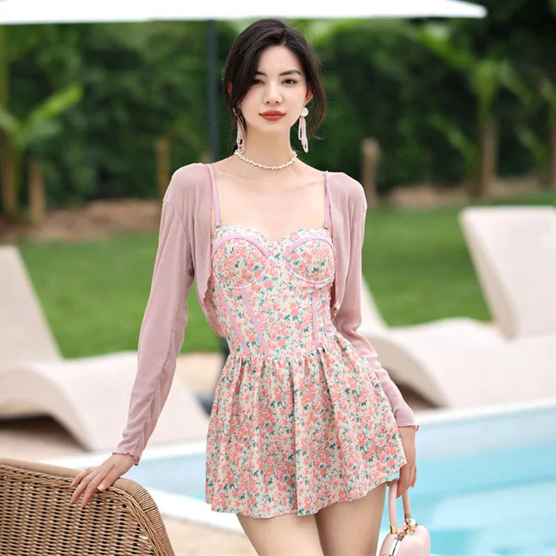 Women's floral suspender one-piece swimsuit in pink and green nylon fabric