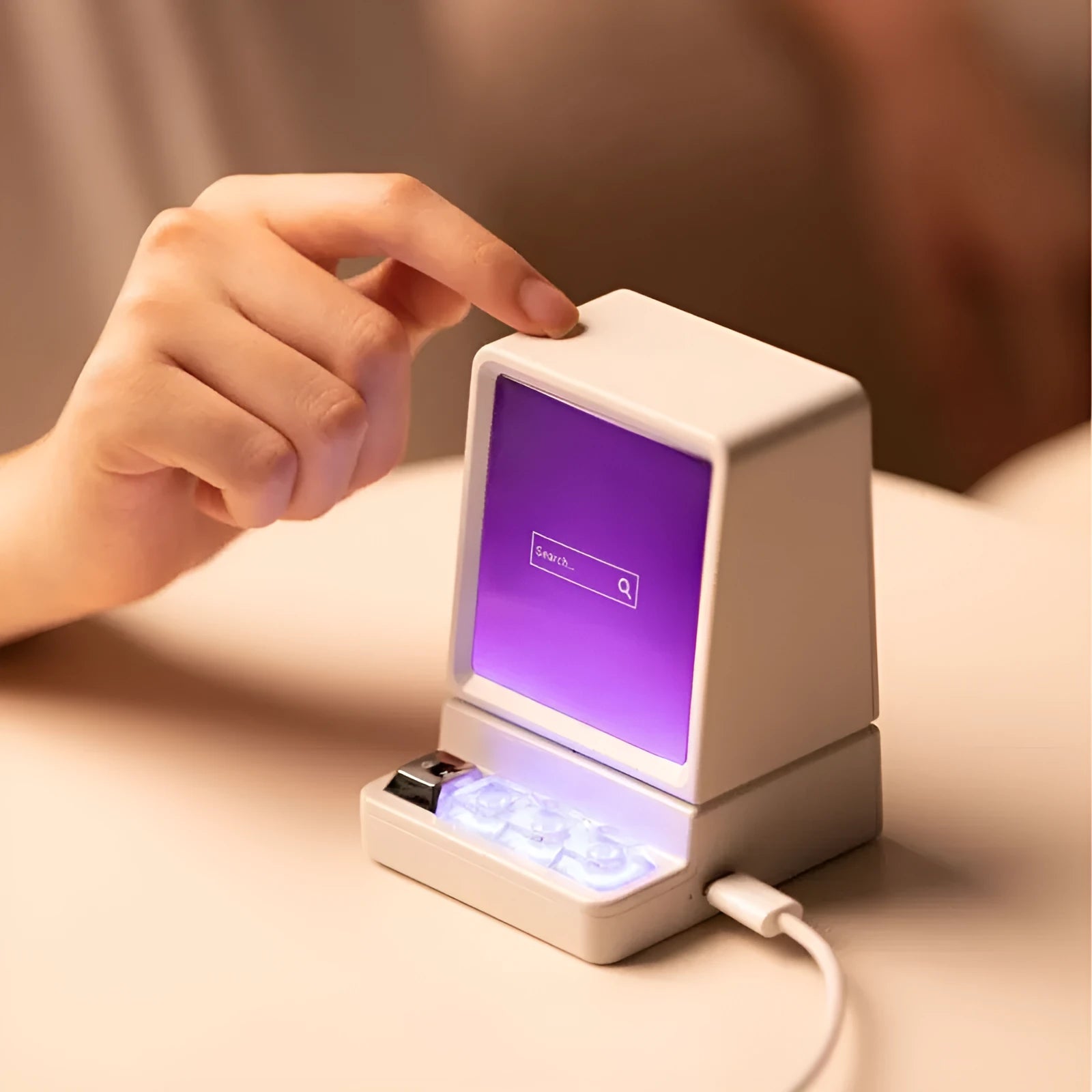 Portable classic computer-shaped Bluetooth speaker in light gray with lighting and voice prompt on a desktop