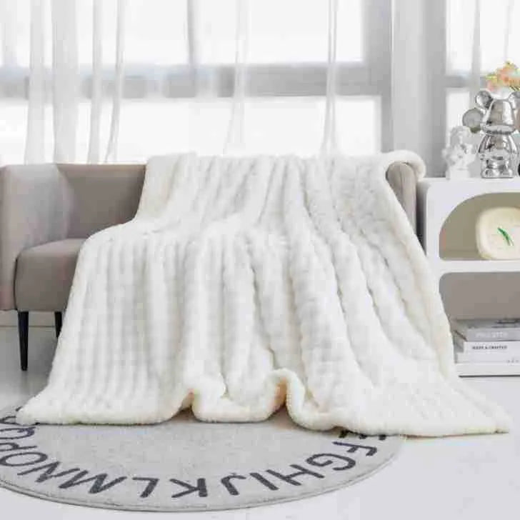 Bubble double layer thick lambskin blanket in beige on a sofa