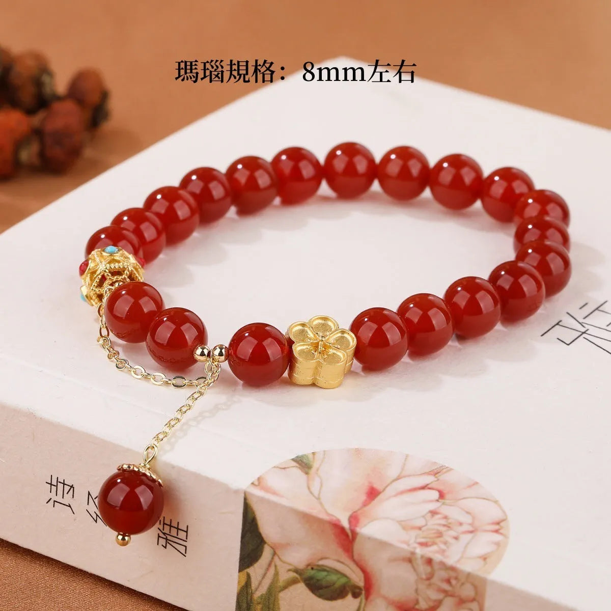 Natural red agate bracelet with 8mm beads and copper peach blossom parts on wrist