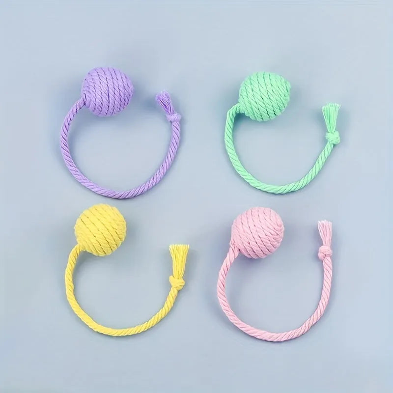 Cat toy ball with rope handle and bell inside in bright colours for kitten play