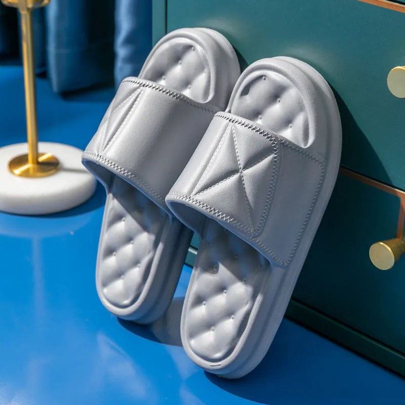 Pair of thick EVA bathroom slippers with textured anti-slip sole in a choice of five colours.