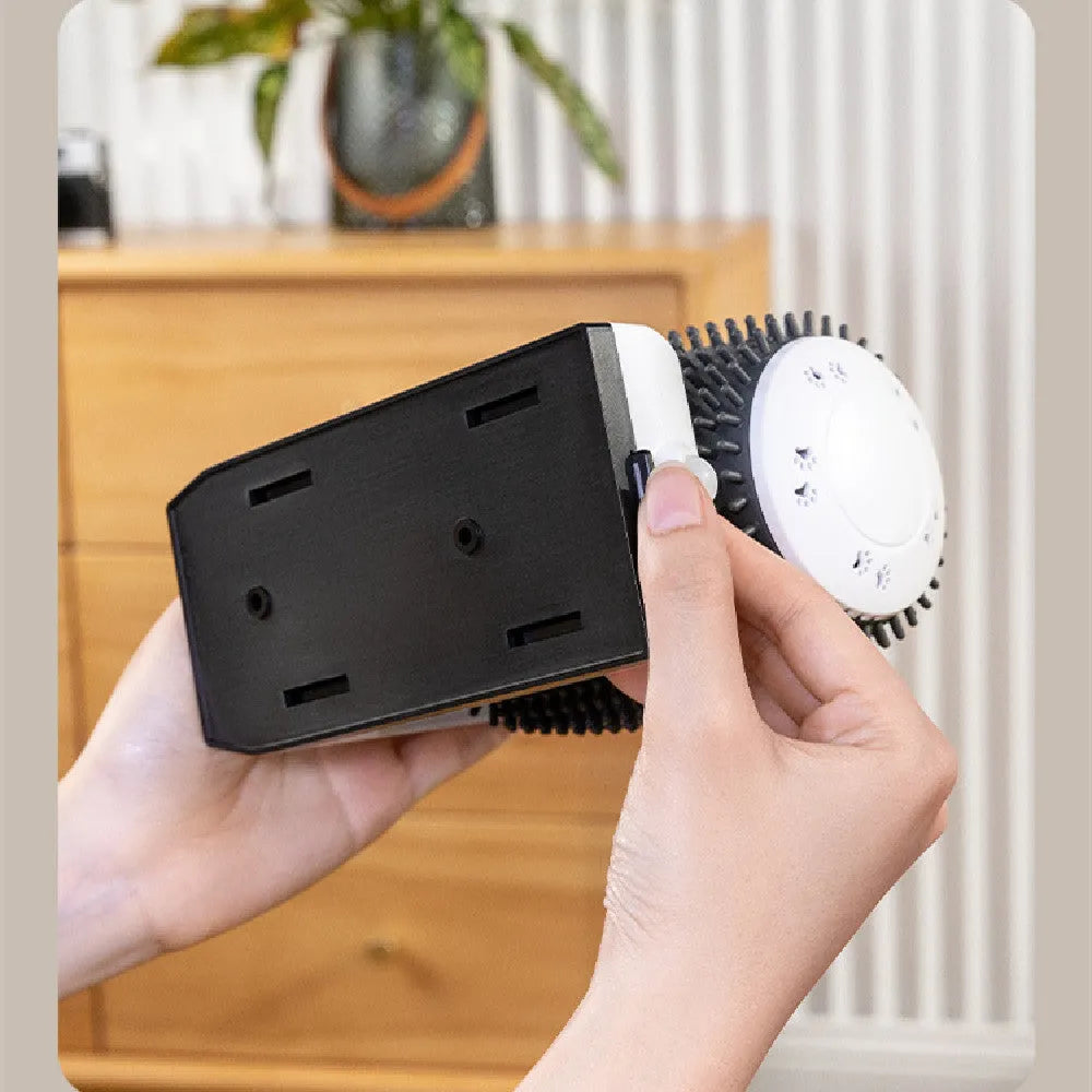 White automatic cat self groomer mounted in a wall corner with soft silicone bristles for grooming and massage