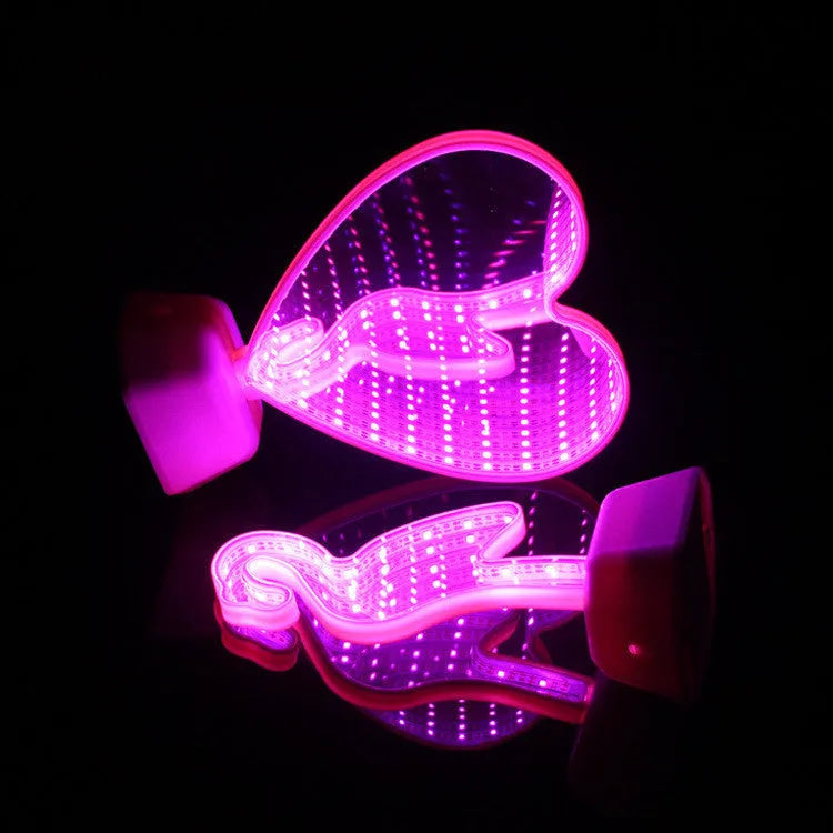 Plastic double-sided LED love tunnel light with rose red illumination on a dark background.