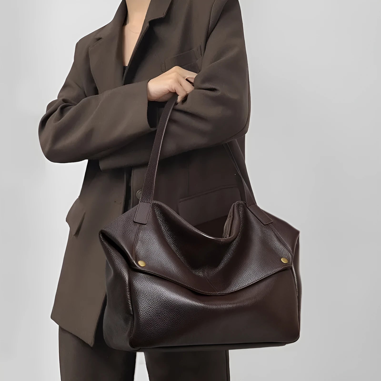 Brown genuine leather women's shoulder bag with horizontal square shape and zippered internal pocket