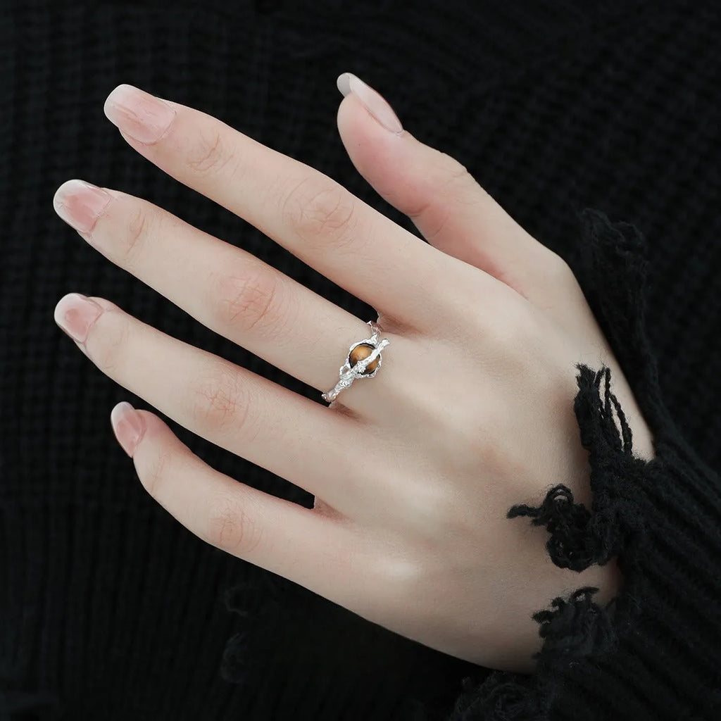 Saturn-inspired adjustable open ring with white gold electroplated finish and silver base