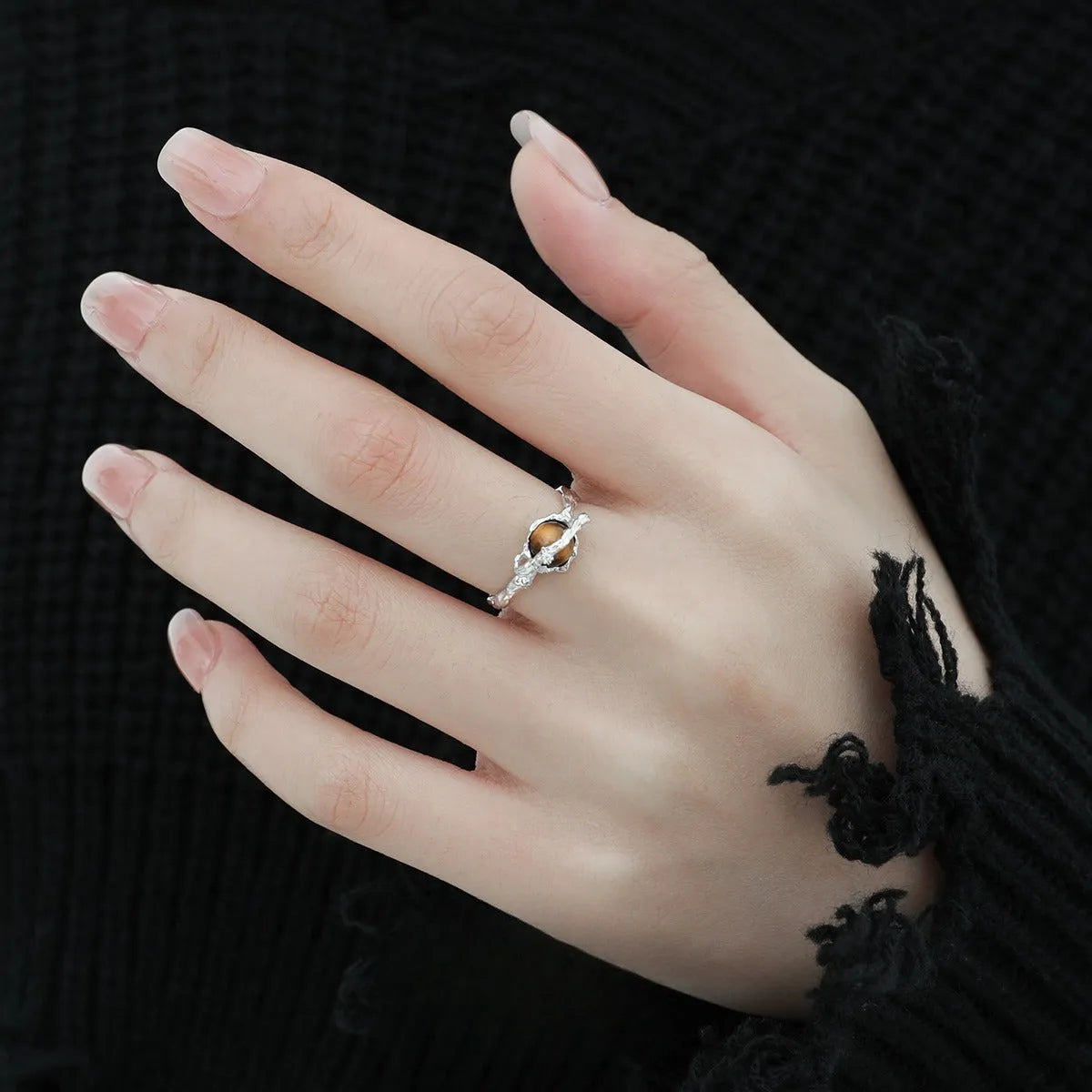 Saturn-inspired adjustable open ring with white gold electroplated finish and silver base