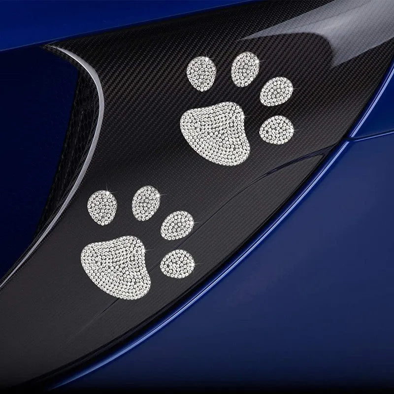 Diamond-encrusted car sticker showing bear paw and butterfly designs on glass with drill stick
