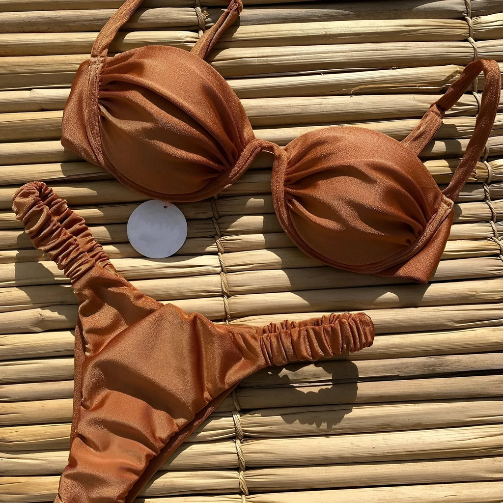 Women's black underwire bikini swimsuit set with briefs style on a mannequin.