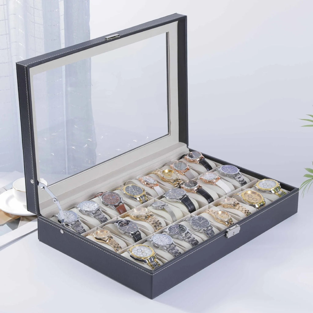 Grey leather watch storage box with clear dustproof lid showing interior watch compartments