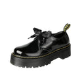 Women's black thick-soled leather shoes with cross strap design and lace-up closure