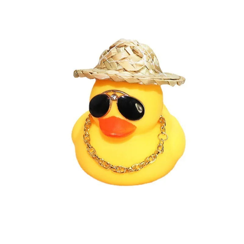 Yellow cartoon duck wearing a straw hat car dashboard ornament with adhesive and sunglasses accessory.