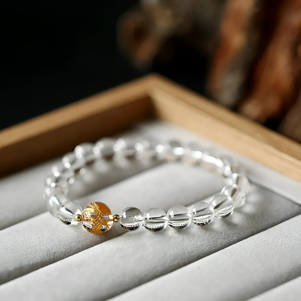 Unisex obsidian black agate white crystal bracelet with 10mm and 8mm beads on neutral background