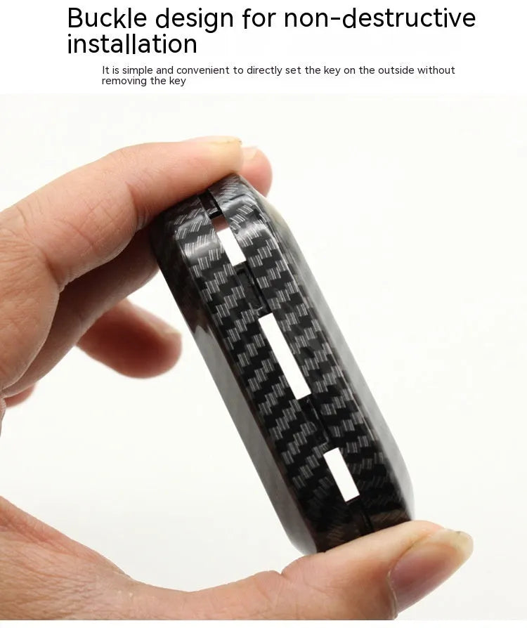 Fiat 500 Boyue car key shell in carbon fibre black ABS plastic, showing button layout.