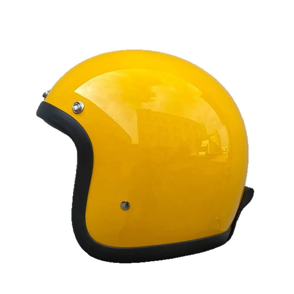 Retro-style open-face motorcycle helmet in glass fibre construction shown in a cement grey colour.