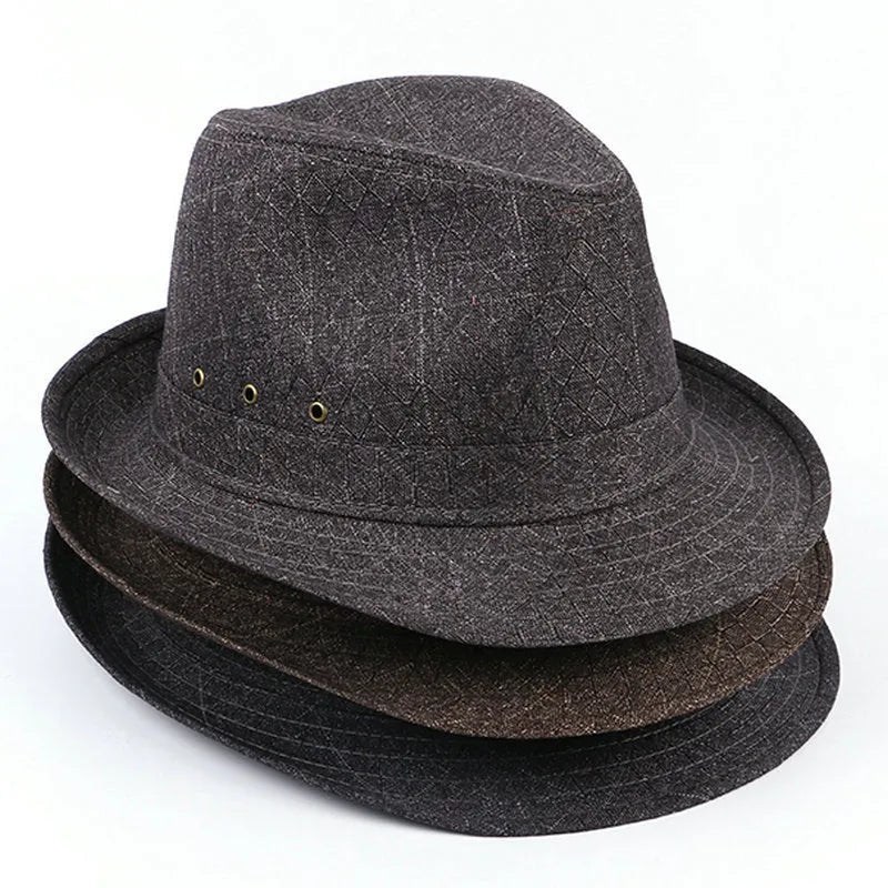 Classic brown fedora hat for men on a stand, showing the brim and structured crown.