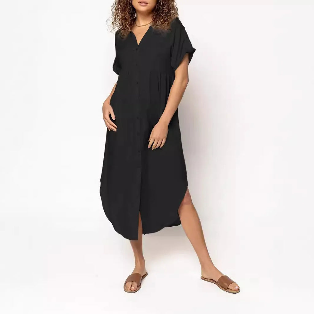 A loose-fitting, solid-colour button-down midi dress on a hanger, shown in apricot colour.