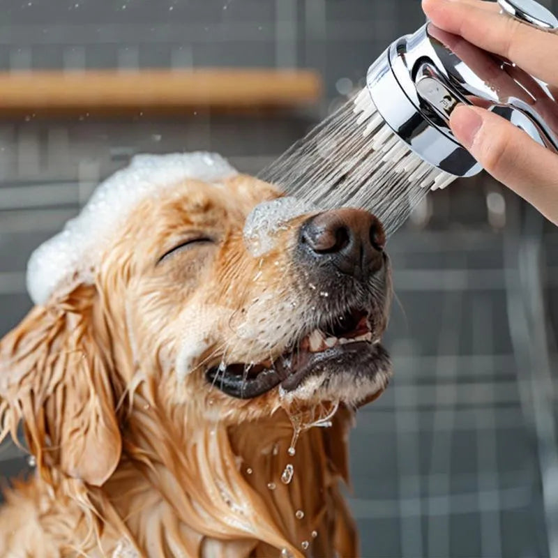 Silver 2 in 1 dog shower attachment with soft silicone comb teeth and ergonomic grip on white background