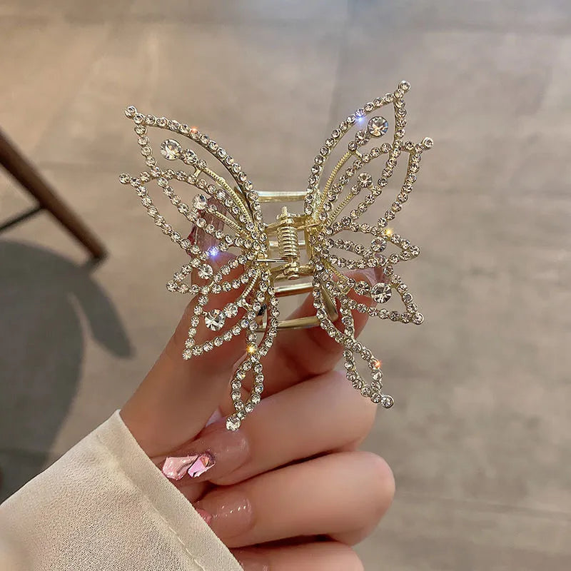 Butterfly-shaped alloy hair barrette for women with pearl or rhinestone decoration, shown from the front.