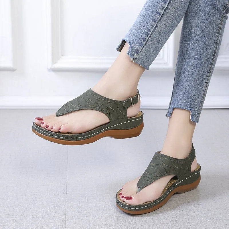 Women's casual wedge heel sandals in black with an adjustable back strap buckle.