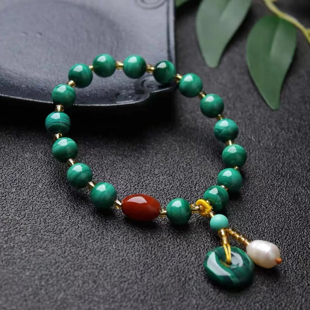 Natural green malachite and red agate barrel bead bracelet measuring 7-8mm with handcrafted unisex design