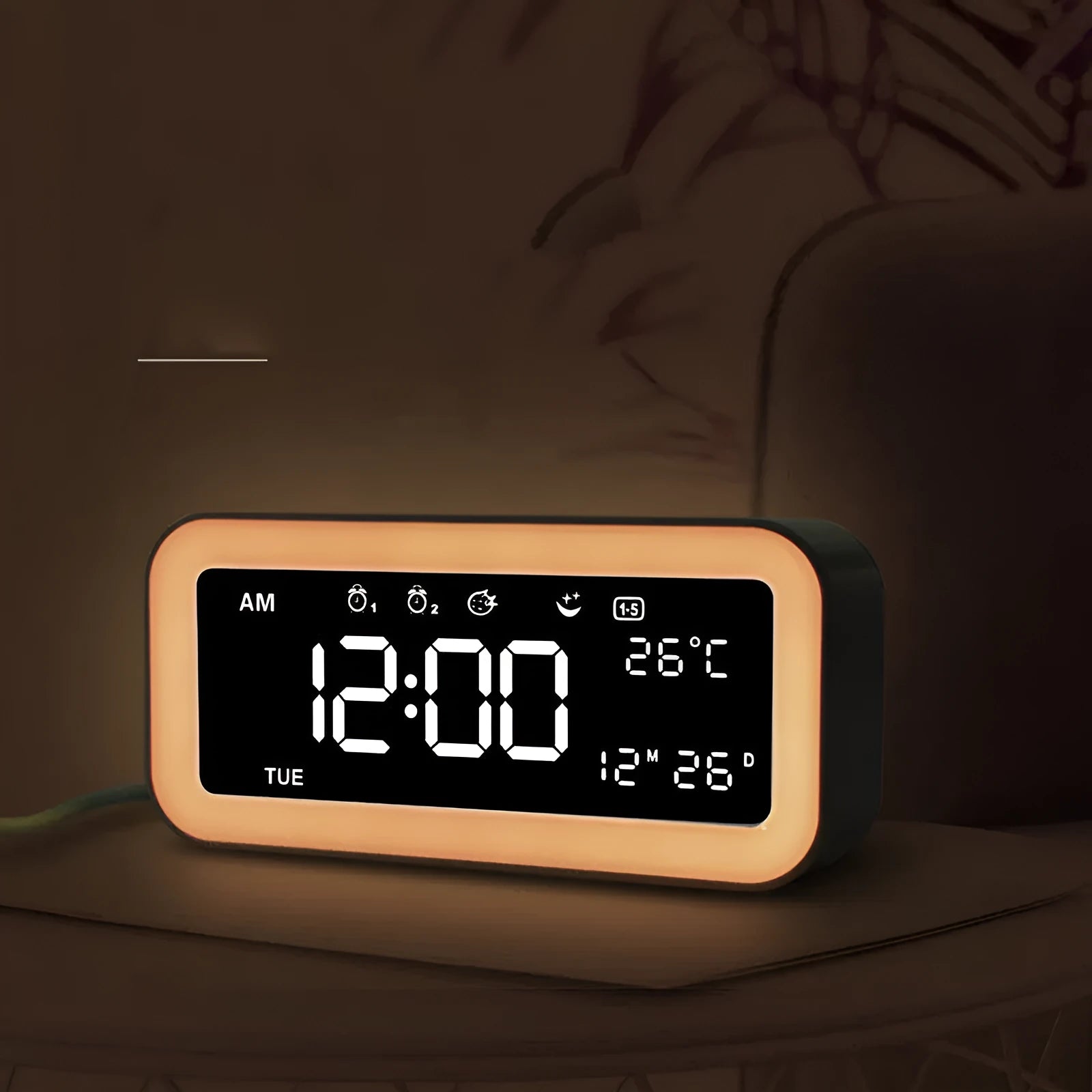 Blue rectangular LED atmosphere light alarm clock with digital display on a wooden desk.